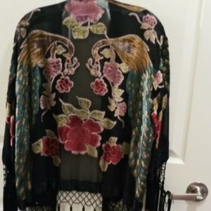 Black silk jacket with flowers.